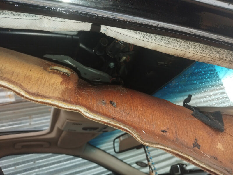 Cleaning sunroof drains with a brush